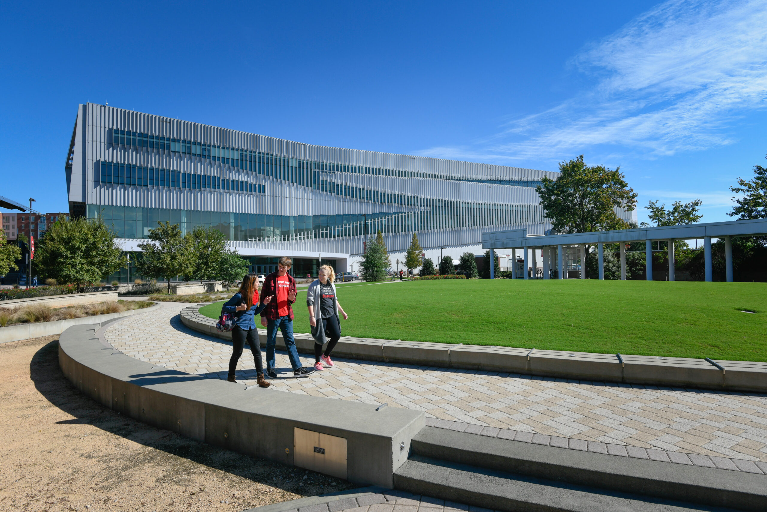 Students walk by and enjoy the day at Hunt library. Photo by Marc Hall